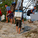 Porters carry voter verifiable paper audit trail (VVPAT) machines and EVMs through the Buxa tiger reserve forest to a remote polling station in Alipurduar district in the eastern state of West Bengal.